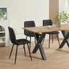 A dining room scene with a wooden table and four black chairs. Náhled obrázku produktu