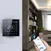 A smart thermostat is mounted on a wall, and a hand is holding a smartphone displaying a thermostat app, with a bookshelf in the background. Produktbild-Vorschau