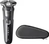 A black electric shaver and its gray travel case are shown against a white background. Náhled obrázku produktu