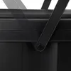 A close-up shot of a black trash can handle and lid. Podgląd zdjęcia produktu