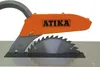 A close-up view of a table saw blade guard with a dust collection hose attached. Náhled obrázku produktu