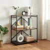 A three-tier shelf unit with various decorative items on display, set against a white wall and next to a window with sheer curtains. Náhled obrázku produktu