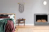 A bedroom with a bed, a nightstand, and a fireplace. Náhľad obrázku produktu