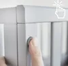 A close-up of a finger pressing a button on a gray frame, with a graphic overlay indicating a click. Produktbild-Vorschau
