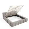 A bed frame with the mattress support slats lifted to reveal the storage compartment underneath. Voir les images du produit