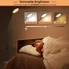 A child sleeping in bed next to a floor lamp, with graphics showing different light settings. Produktbild-Vorschau