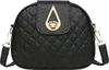 A black quilted crossbody bag with gold hardware. Náhled obrázku produktu