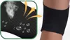 A close-up view of a black knee brace on a person's leg, with a magnified inset showing the fabric's breathability and water droplets. Produktbild-Vorschau