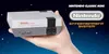 A hand holding a Nintendo NES Classic Mini console against a starry blue background. Náhled obrázku produktu