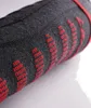 A close-up of a rolled-up sock with a red pattern. Produktbild-Vorschau