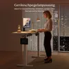 A woman is working at a standing desk in a modern office or home office setting at night. Anteprima dell’immagine prodotto