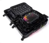Several black suitcases of varying sizes are nested inside each other, with the largest one open. A smaller, black accessory case with colorful paint splatters is placed inside the largest suitcase. Náhled obrázku produktu