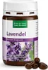 A bottle of Sanct Bernhard Lavendel Nerven-Kapseln with some capsules scattered in front. Produktbild-Vorschau