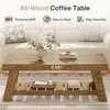 A coffee table in a living room setting with decorative items. Anteprima dell’immagine prodotto