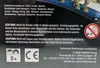 Close-up of the back of a product box with warning labels and company information. Produktbild-Vorschau