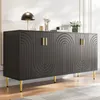 A dark gray sideboard with gold handles and legs, decorated with a wave pattern, is shown in a well-lit room. Produktbild-Vorschau