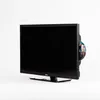 A black television with a DVD inserted into its side, set against a white background. Produktbild-Vorschau