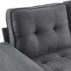 A close-up view of a tufted sofa cushion. Produktbild-Vorschau