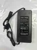 A black power charger for an electric scooter is shown on a light gray background. Podgląd zdjęcia produktu