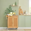 A kitchen scene with a wooden kitchen cart and cabinets. Produktbild-Vorschau