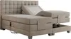 A beige boxspring bed with an adjustable headrest and footrest, shown from a side-diagonal angle. Produktbild-Vorschau