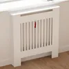 A white radiator cover with vertical slats is shown in a room with wooden flooring and white walls. Anteprima dell’immagine prodotto