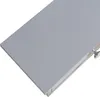 A close-up, angled view of a light gray shelf with a small silver knob on the right side. Podgląd zdjęcia produktu