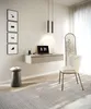 A modern home office setup with a floating desk, laptop, chair, and decorative elements. Voir les images du produit