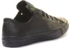 A black leather Converse Chuck Taylor low-top sneaker is shown from the side against a white background. Náhled obrázku produktu