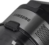 A close-up view of the top section of a Samsung cordless vacuum cleaner, showing the brand name and a button. Podgląd zdjęcia produktu