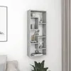 A gray wall-mounted shelf unit with decorative items on it, next to a curtain and a framed picture. Voir les images du produit