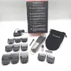 A collection of hair clippers and accessories laid out on a white surface, with a product box in the background. Podgląd zdjęcia produktu