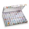 A white box with many compartments, each containing a small collectible toy figure. The box is open, showing the contents. Produktbild-Vorschau