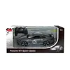 A toy R/C car in its packaging, with a remote control visible. Voir les images du produit