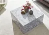 Couchtisch MONOBLOC von oben mit marmorierter weißer Oberfläche und Dekoaccessoires. Anteprima dell’immagine prodotto