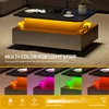 A modern coffee table with integrated LED lighting, showcasing different color options. Produktbild-Vorschau