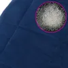 A close-up view of a blue weighted blanket with a circular inset showing small clear beads. Produktbild-Vorschau