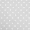 A close-up view of a grey fabric with white polka dots. Anteprima dell’immagine prodotto