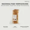 A bag of dog treats with marketing text about sustainable packaging. Produktbild-Vorschau