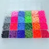 A clear, overhead view of a plastic organizer box filled with colorful, flat, round beads, commonly known as Heishi beads. Náhled obrázku produktu