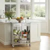 A kitchen cart filled with fresh produce is placed in a bright kitchen with large windows overlooking a garden. Anteprima dell’immagine prodotto