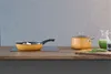 A kitchen counter with cooking utensils and ingredients. Podgląd zdjęcia produktu