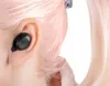 A close-up shot of a black wireless earbud inserted into a person's ear. Náhled obrázku produktu