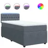 A dark gray box spring bed with a tufted headboard and a white mattress topper, illuminated by blue LED lights along the headboard. Three circular insets above the bed show the headboard with different colored LED lights (green, red, purple), and a color w Produktbild-Vorschau