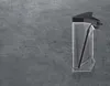 A clear, well-lit product shot of a milk container on a textured gray floor. Anteprima dell’immagine prodotto