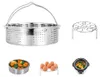 A collection of kitchen accessories for an Instant Pot, including a steamer basket, an egg rack, and a smaller steamer basket with food. Produktbild-Vorschau