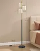 A floor lamp is shown next to a bed in a bedroom setting, with dimensions indicated by measurement lines and text. Produktbild-Vorschau