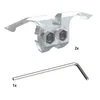 A product shot showing two clear plastic dental braces with metal screws, and a silver Allen wrench below them. Produktbild-Vorschau