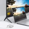A laptop is connected to a large monitor via a USB-C hub, showcasing a 4K display. Produktbild-Vorschau