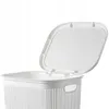 A white plastic laundry basket with its lid open, shown from a slightly elevated side angle against a white background. Voir les images du produit